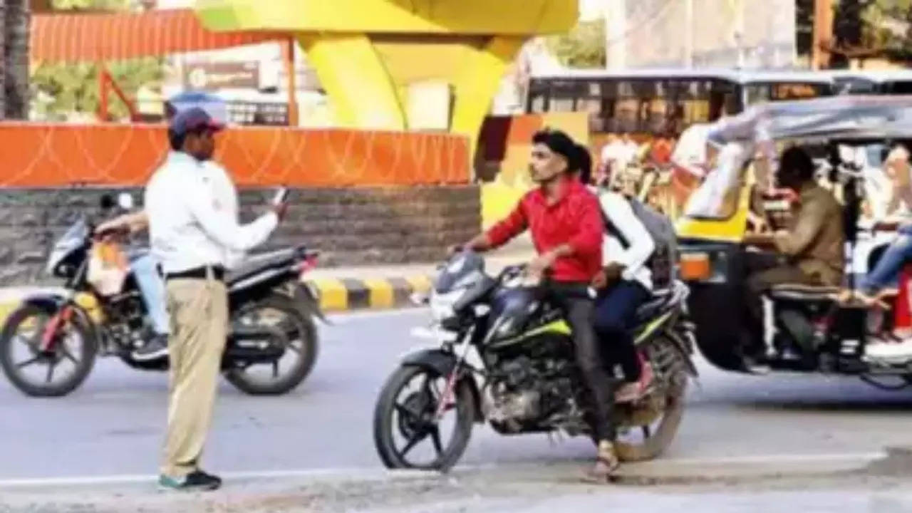 Beware bikers! Talking to pillion while riding now punishable in this state: Details Beware bikers! Talking to pillion while riding now punishable in this state: Details