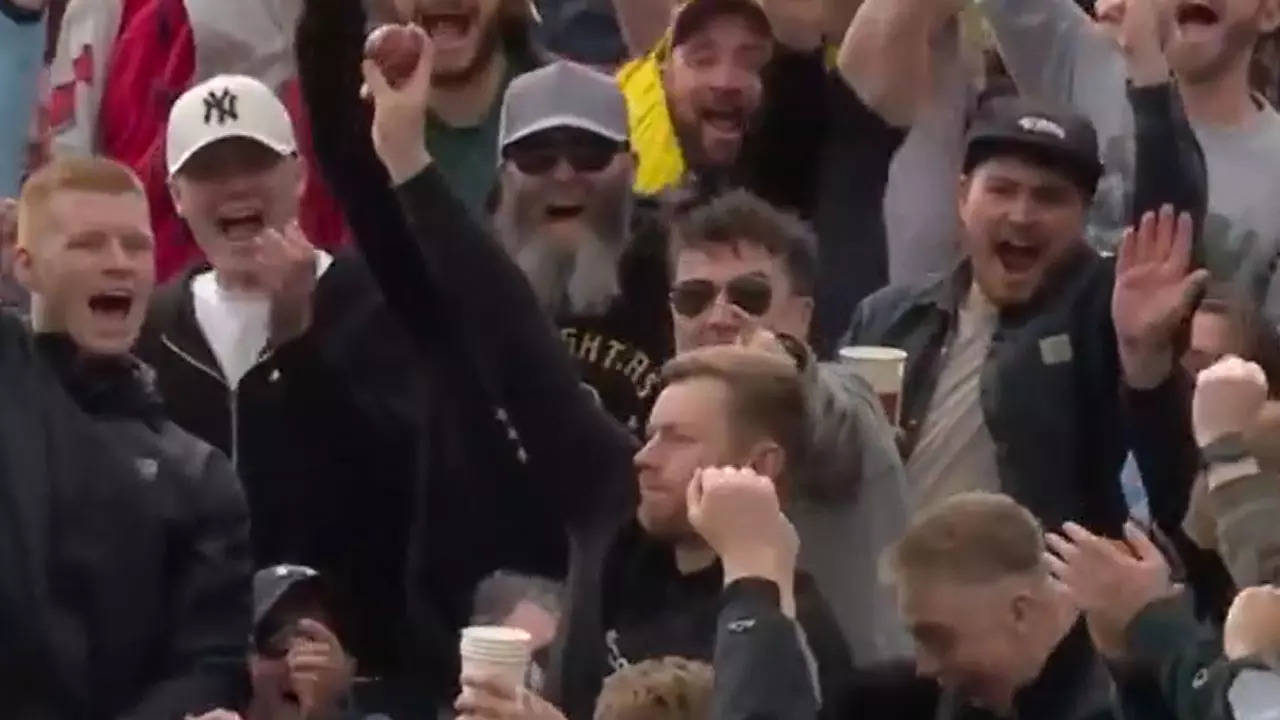 Coolest spectator catch ever? Drink in one hand, ball in other and a salute to top it off. Watch | Cricket News