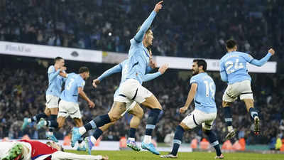 Premier League: John Stones strikes late to salvage point for Man City against 10-man Arsenal | Football News